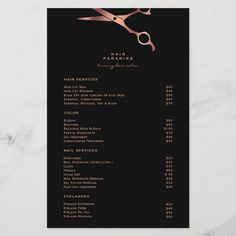 a black and gold salon menu with pink scissors on the top, in front of a white marble countertop