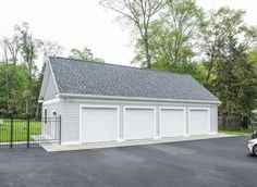 a car parked in front of a white garage