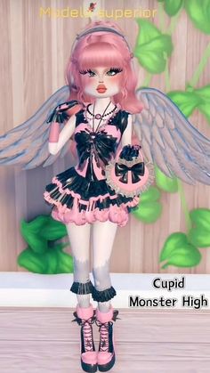 a pink and black doll with wings on her head standing in front of a wooden wall