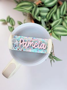 a cup that has some kind of sticker on top of it with the word pamella in it