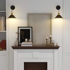 a white fireplace with two lamps on each side