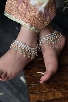 Our Multi-layered pearl anklets are handcrafted with love and strewn with semi-precious pearl and mint stone hangings. This chic pair of anklets will wrap beautifully around your ankles and lend an edgy design to your attire. Elevate your style with our enchanting pearl anklets and let your beauty shine. Closure - Lobster Weight - 76gm (pair) Semi Precious Stone Jewelry, Tassel Anklet, Anklets Indian, Wedding Flower Jewelry, Fancy Jewelry Necklace, Beautiful Anklet, Anklet Designs, Pearl Anklet, Edgy Design