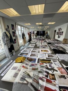 a long table covered in pictures and papers