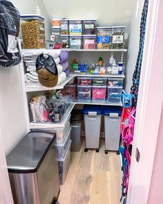 the pantry is stocked with lots of items and storage bins for all kinds of things