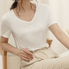 $28.99 USD  elicate V neck design shows a love of simplicity.  Plain color, Easy pull-on style.  Natural Model Fabric, soft and smooth. Solid Color Stretch V-neck T-shirt, Elegant V-neck Plain Tops, Plain V-neck Top, Elegant V-neck T-shirt For Summer, Elegant V-neck Tops For Everyday, Elegant Everyday V-neck Tops, Elegant V-neck Everyday Tops, V-neck Stretch T-shirt, Solid Stretch V-neck T-shirt