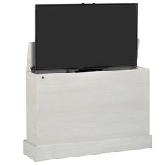 a flat screen tv sitting on top of a wooden stand next to a white wall