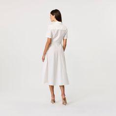 The Megan is our take on this classic shirt dress. The crisp white midi dress feature our signature TOCCIN tie-front detail and gold top button.