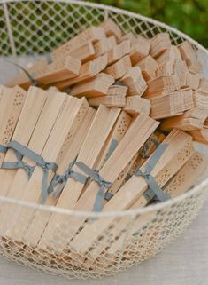 a basket filled with wooden pieces on top of a table