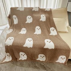 a blanket that has ghost on it