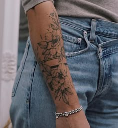 a person with a flower tattoo on their arm