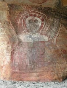 an image of a cave with paintings on it