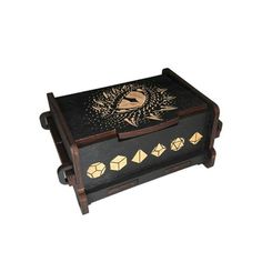 an old wooden box with decorative designs on it's lid and sides, sitting against a white background