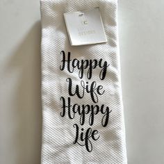 a white towel with the words happy wife on it