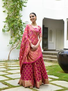 Women's Banarsi Pink Bandhani Lehenga (3Pc) - Saras The Label – Trendia Bandhani And Leheriya Dress, Bandhej Dupatta Lehenga Choli, Silk Dupatta Draping Styles On Lehnga, Upada Bandhani Lehenga, Pink Bandhani Lehenga, Chunari Print Lehenga, Bandhej Lehenga Designs, Bandhani Lehenga Designs, Banarsi Lehenga Blouse Designs