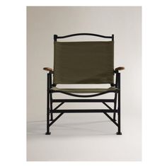 the folding chair is made from black metal and has a green canvas seat cover on it