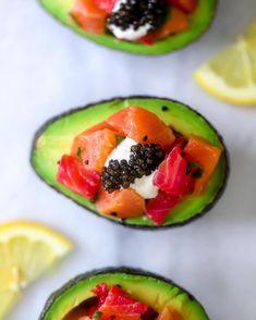 avocado cups with salmon, blackberries and capers