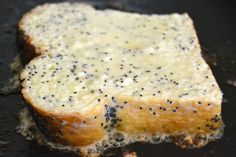 two pieces of bread that have been cooked in a frying pan with some black dots on them