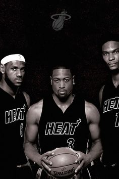 three men in black and white basketball uniforms are posing for a photo with the miami heat logo on their chest