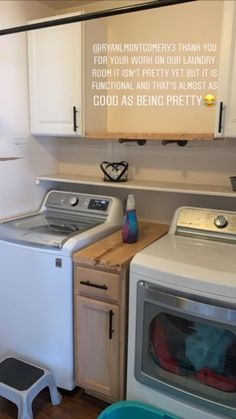 a washer and dryer sitting next to each other in a room with white cabinets