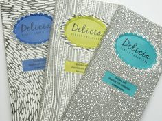 three different types of fabric with labels attached to the side of each piece, one for deliceia