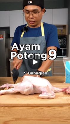 a man cutting up a chicken on top of a wooden counter in a kitchen with the words avan potong 9