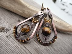 amber bronze earrings with natural tiger's eye stone, wire wrapped jewelry, unique beaded hand forged earrings, boho dangle teardrop, copper by TFUniqueTwists on Etsy https://www.etsy.com/listing/784136589/amber-bronze-earrings-with-natural Wire Jewerly, Wire Wrapped Turquoise, Interesting Jewelry, Framed Jewelry, Wire Wrapped Stone Jewelry, Wire Wrap Jewelry Designs, Wire Wrapped Jewelry Diy, Weaving Ideas, Copper Jewelry Handmade