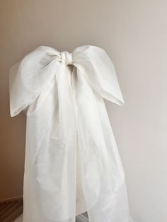 Beautiful Oversized Silk Organza Wedding Bow Veil. Handmade in Yorkshire UK using the finest British sourced silk.  Bow measures approximately 56cm across and approximately 250cm long. Colour shown is Ivory. As these items are handmade to order by me, tweaks to the measurements and design are possible (this will incur a charged) please contact me to discuss your requirements. Bow Vail, Elegant White Veil For Ceremony, Elegant White Ceremony Veil, Elegant White Formal Veil, Bow Veil, Organza Bow, Bow Wedding Dress, Angel Outfit, Yorkshire Uk