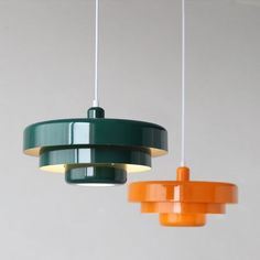 three different colored lights hanging from the ceiling