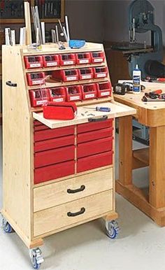 a workbench with many drawers and tools on it