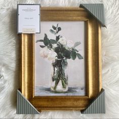 a painting of white roses in a mason jar on a furnishing area next to a card