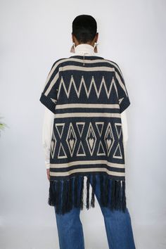 Slide on and go with this easy to wear poncho. She’s understated with neutral colors, but her woven details are what makes her the perfect statement of your look. The tassels are a fun touch and gives her some added length. One size fits most Made of Acrylic One Size Knit Poncho With Fringe, Casual One Size Poncho With Fringe, Casual One-size Poncho With Fringe, One Size Tassel Poncho For Spring, Spring Poncho With Tassels, Spring Poncho One Size With Tassels, Spring Poncho With Tassels One Size, One Size Spring Poncho With Tassels, Winter Cape With Tassels