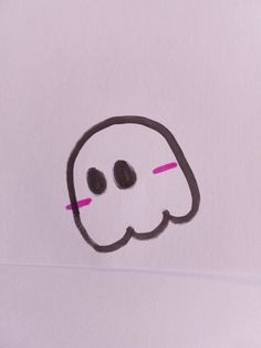 a white piece of paper with a drawing of a ghost on it's face