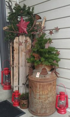 a potted plant sitting on top of a wooden barrel next to a red lantern