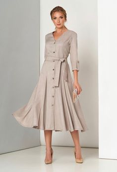 A classic elegant dress with a fitted silhouette, V-neck and 3/4 sleeves. Includes a belt. Material: costume linen Made in Europe Semi-formal Beige V-neck Dress, Beige V-neck Semi-formal Dress, Formal V-neck Linen Dress, Fitted Beige Belted Dress, Elegant Knee-length Belted Dress With Button Closure, Fitted V-neck Linen Dress For Work, Fitted Linen V-neck Dress For Work, Elegant 3/4 Sleeve Dresses With Buttons, Elegant Dresses With 3/4 Sleeves And Buttons