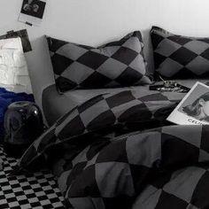 a black and white checkered comforter on a bed