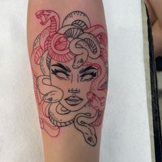 a woman's face with snakes on her arm