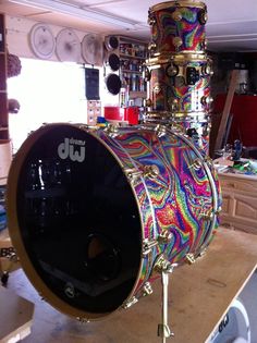 a colorful drum sits on top of a wooden table