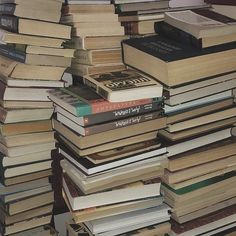 a pile of books stacked on top of each other