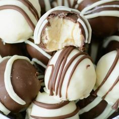 a bowl filled with chocolate covered desserts on top of a table