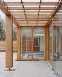 an open room with wooden slats and glass doors