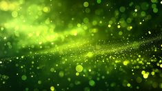 an abstract green background with bokets and sparkles in the dark night sky