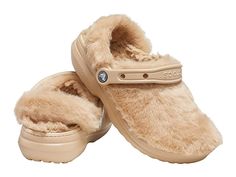 Crocs Classic Fur Sure - Women's Shoes : Chai : The legendary Classic Clog, now with faux-fur fuzz inside and out. Great indoors or out. Incredibly light and easy to wear with slippers-like comfort. Slip-on sandal with classic Crocs oblique toe silhouette. Faux fur lining. Pivoting heel straps for a more secure fit. Customizable backstrap for Jibbitz charms. Dual Crocs Comfort: Blissfully supportive. Soft. Cradling comfort. Easy to clean and quick to dry. Imported. Weight of footwear is based on Lined Crocs, Crocs Women, Cozy At Home, Classic Slippers, Crocs Clogs, Crocs Classic Clogs, Fuzzy Slippers, Women's Crocs, Cold Weather Fashion