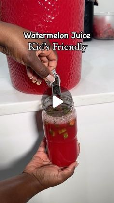 someone is holding a jar with liquid in it and the words watermelon juice kid's friendly