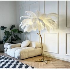 a living room with a palm tree in the corner