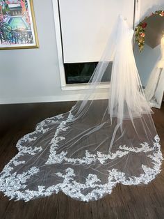 Introducing our elegant Scallop Lace Cathedral Length Long Wedding Veil. With intricate lace detailing of different sections, this affordable veil will add a touch of elegance to any wedding ensemble. The sides of the veil are left free of lace for a modern twist on a classic design. Lace Vail, Lace Wedding Veils, Long Lace Veil, Long Wedding Veil, Lace Cathedral Veil, Lace Veils Bridal, Long Veil Wedding, Bride Veil, Chapel Veil