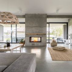 a living room with a fireplace and couches