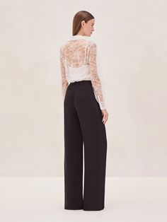 The Luzia sheer lace blouse can be styled with or without the slip, depending on how bold you're feeling. Perfect for layering or as a standout on its own, Luzia's intricate details and versatile design make it a must-have. Whether you’re pairing it with high-waisted shorts, sleek trousers, or even a statement skirt, this top instantly elevates any look. Easy, chic, and undeniably stylish—Luzia is ready for whatever vibe you're going for. Statement Skirt, Easy Chic, Skirt Jumpsuit, New Arrival Dress, Lace Blouse, Sheer Lace, Intricate Details, Skirt Pants, High Waisted Shorts