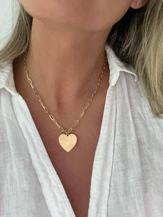 Vintage Inspired Gold Heart Necklace  D E T A I L S - 18k Gold Filled Paperclip Chain 3mm  - Gold Filled Pendant  - Pendant Height: 25 millimeters - Pendant Width: 21 millimeters - Lobster Clasp Closure - Made with love by Dylan Rae *Model is wearing the 16" Chain  P A C K A G I N G Dylan Rae Jewelry is elegantly presented in our premium microfiber jewelry case, ensuring both protection and a polished presentation. If you require separate packaging for multiple items, kindly let us know. C A R E Vintage Heart Necklace, Heart Necklace Vintage, Chain With Pendant, Gold Heart Pendant, Gold Chain With Pendant, Heart Pendant Gold, Gold Heart Necklace, Vintage Heart, Necklace Vintage