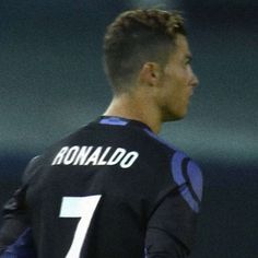 a male soccer player in a black uniform