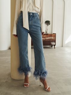 Straight cut jeans with a high waistline featuring fluffy feathers on the pant legs.- straight cut- high waistline- removable feather decor Fluffy Pants Outfits, Feathers Jeans, Jeans With Feathers, Sewing Trendy Clothes, Feather Trim Jeans, Pants With Feathers, Feather Clothes, Feather Pants, Feather Outfit